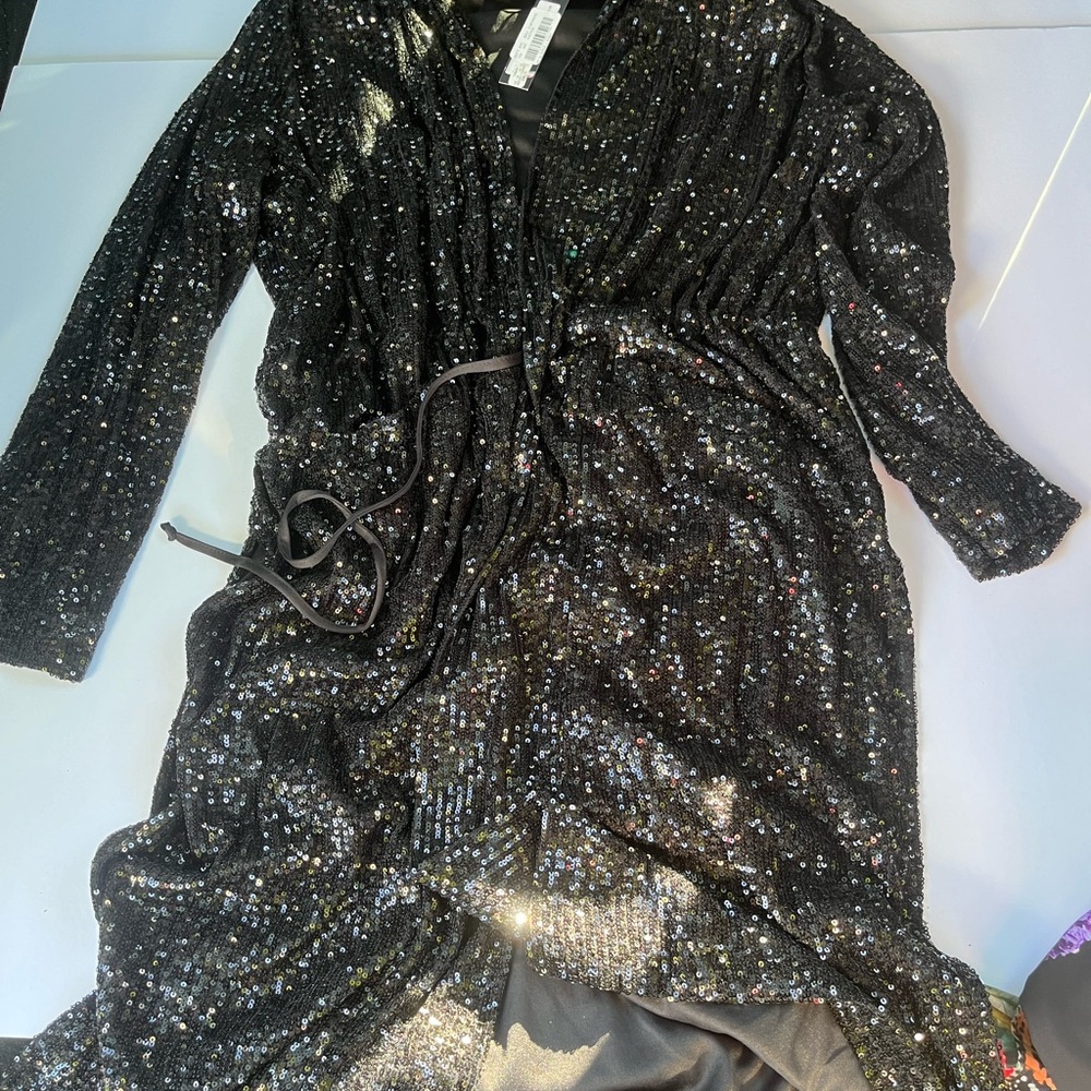This is a Steve Madden black sequin mini dress long sleeves and tie belt size m